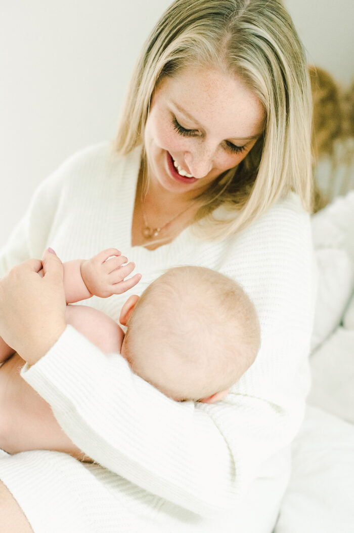 mother and baby girl snuggle together